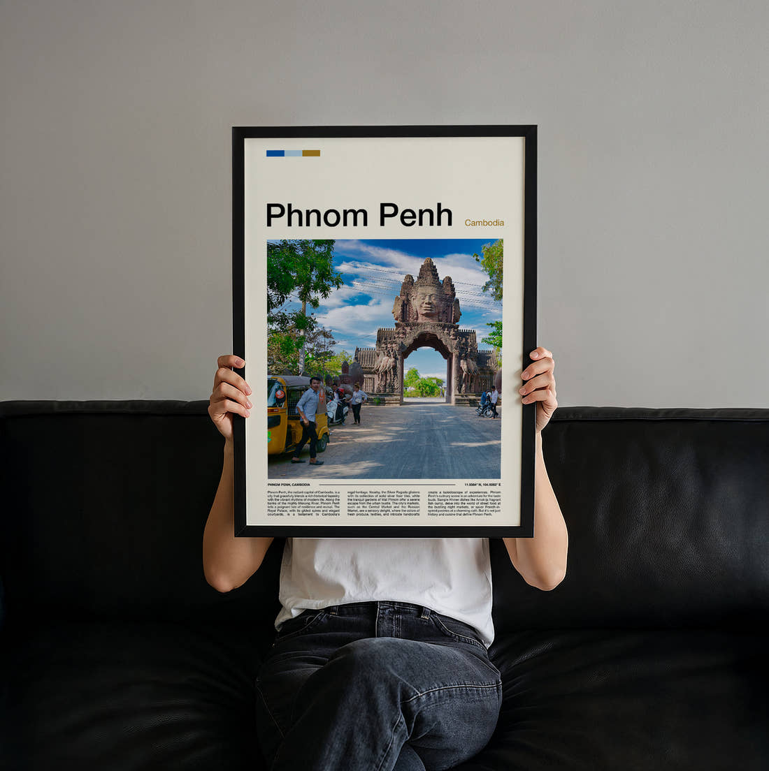 Phnom Penh Temple Gateway Travel Print held up by hand to show the size of the print