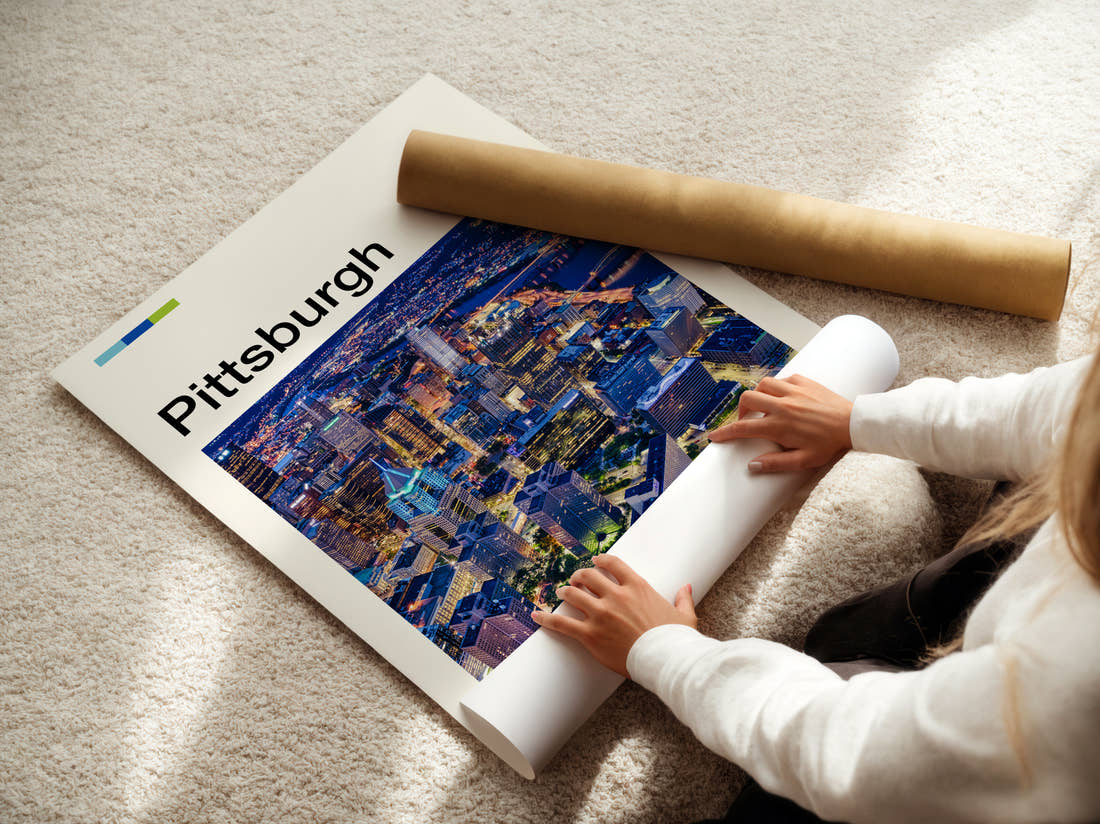 Pittsburgh Night Skyline From Above Travel Print being unrolled from its postal tube