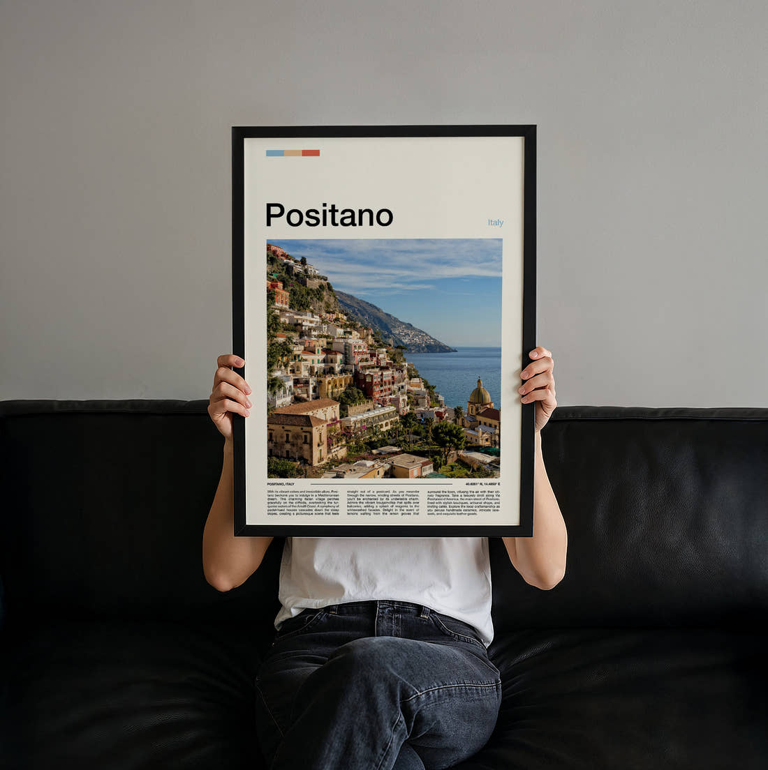 Positano Hillside Town And Sea Travel Print held up by hand to show the size of the print