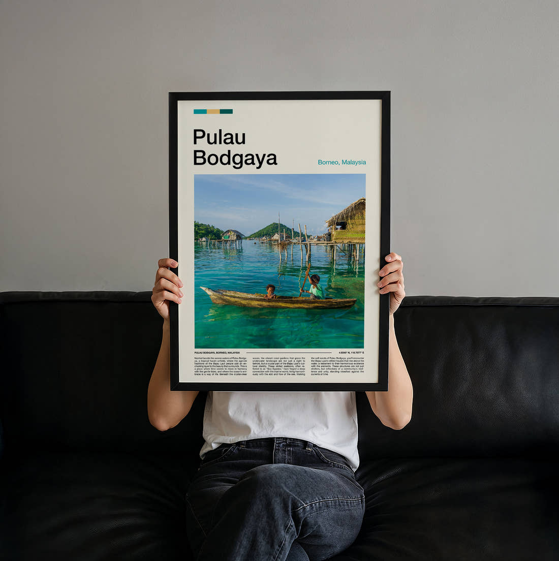 Pulau Stilt Houses Over Water Travel Print held up by hand to show the size of the print