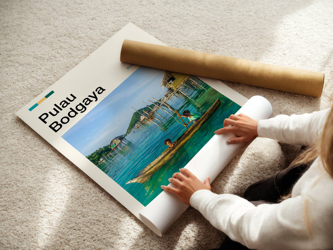 Pulau Stilt Houses Over Water Travel Print being unrolled from its postal tube