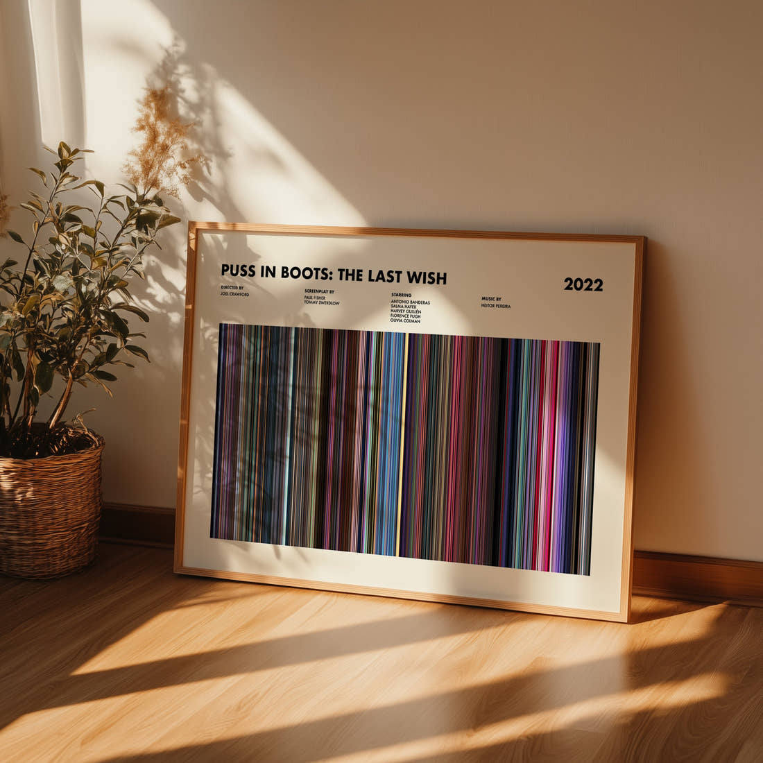 Puss in Boots: The Last Wish Movie Barcode Poster framed and leaning against a wall on a wooden floor