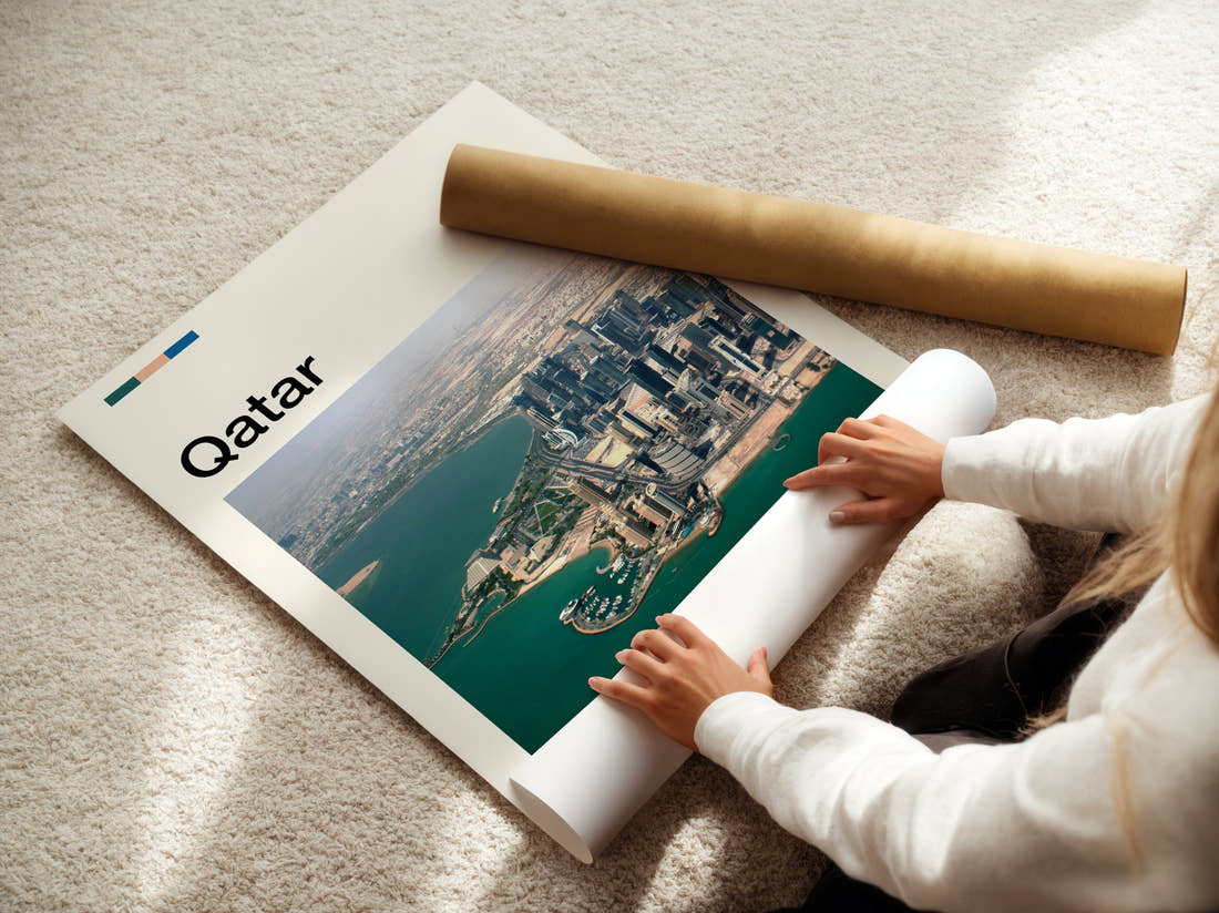 Qatar Aerial View Of Skyline Travel Print being unrolled from its postal tube