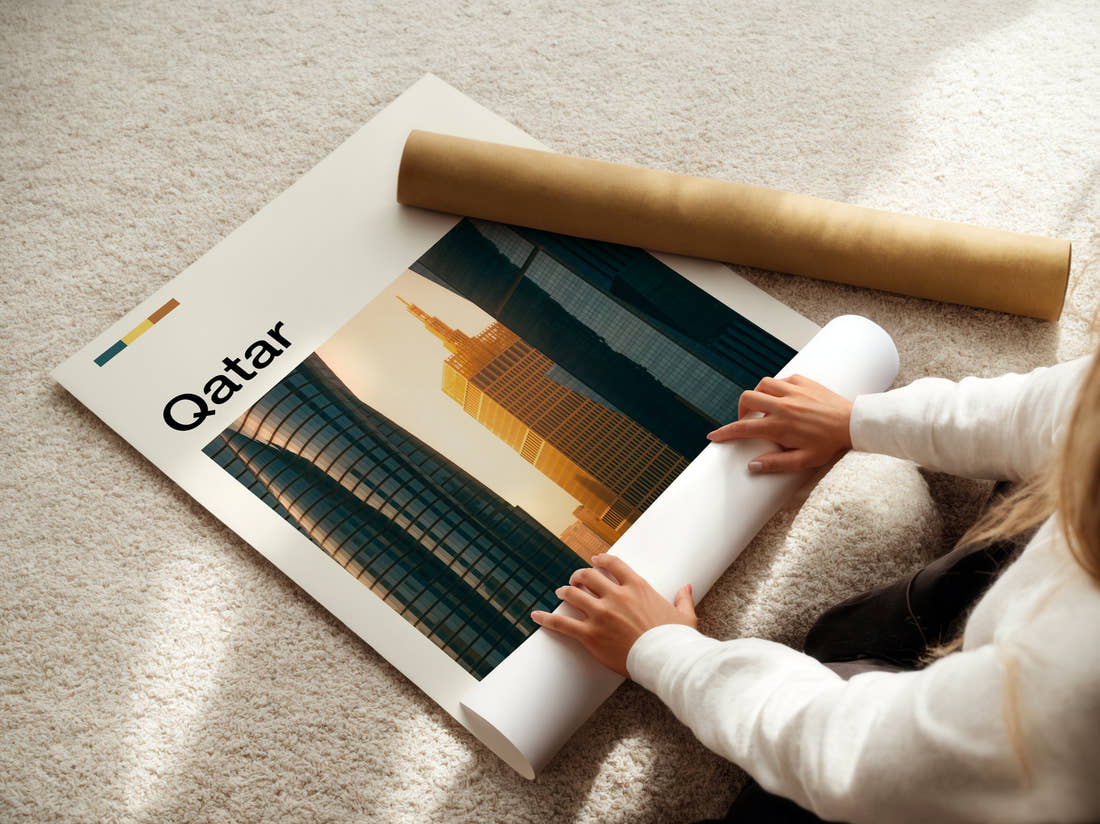 Qatar Golden Skyscraper Travel Print being unrolled from its postal tube
