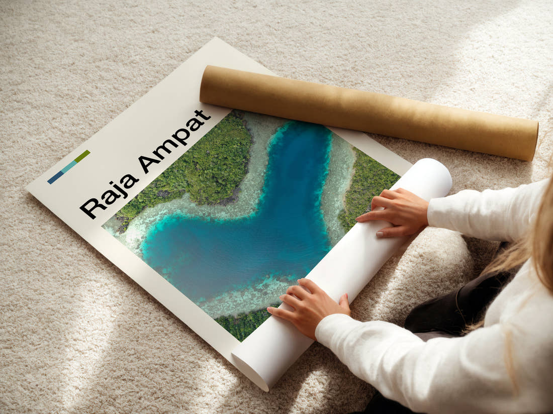 Raja Ampat Heart-Shaped Lagoon Travel Print being unrolled from its postal tube
