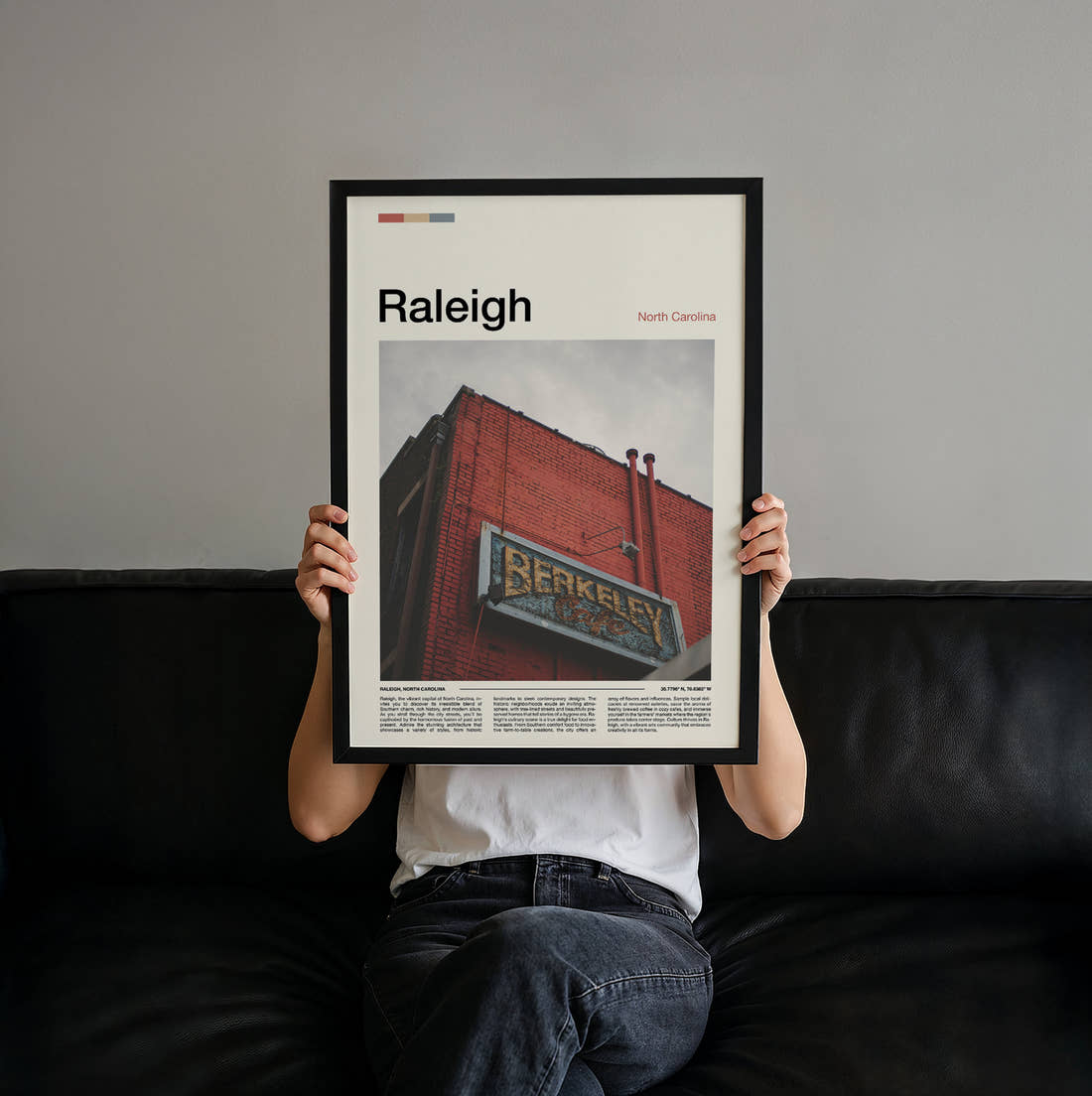Raleigh Brick Building With Sign Travel Print held up by hand to show the size of the print