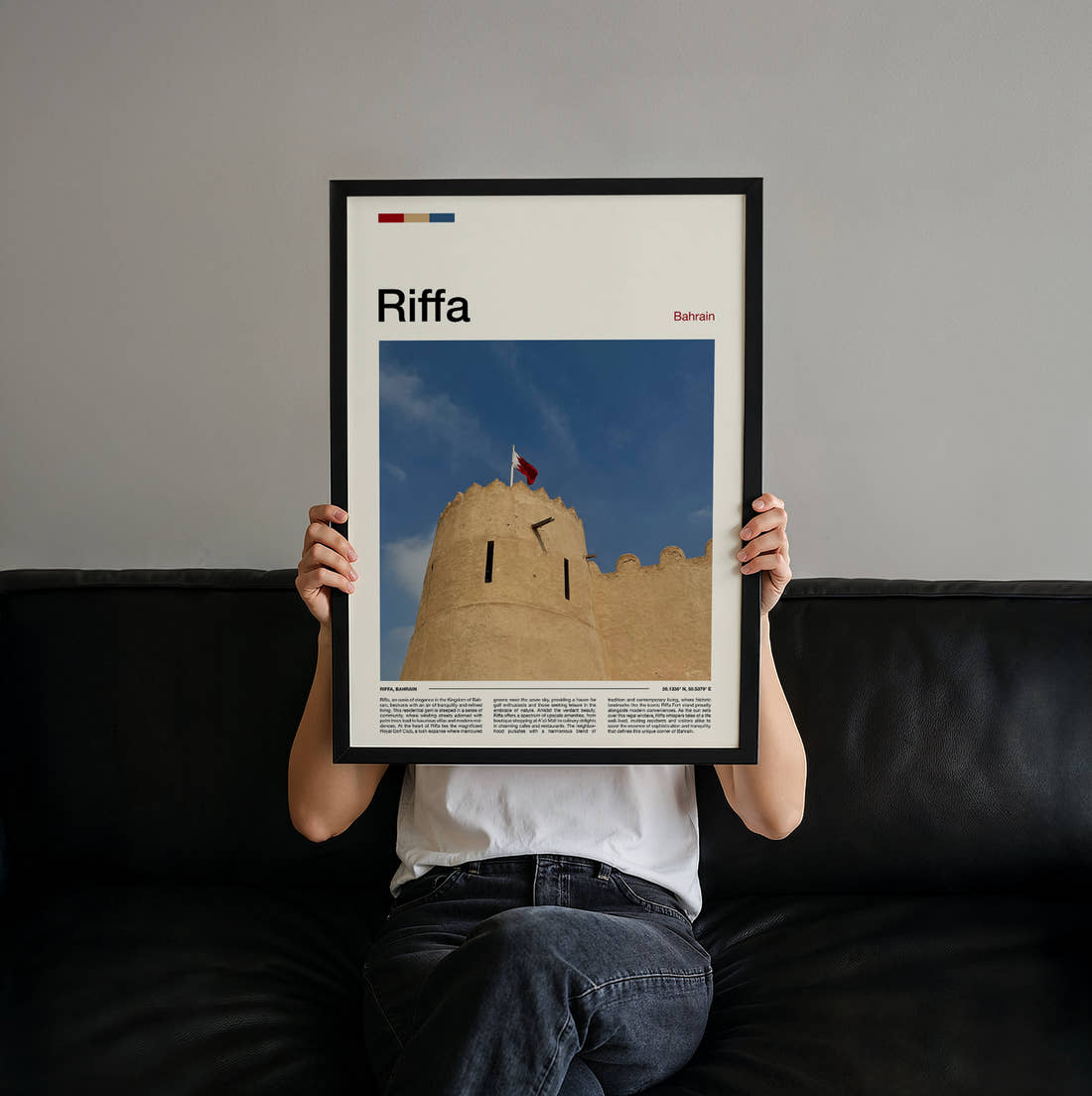 Riffa Fort With Flag Travel Print held up by hand to show the size of the print