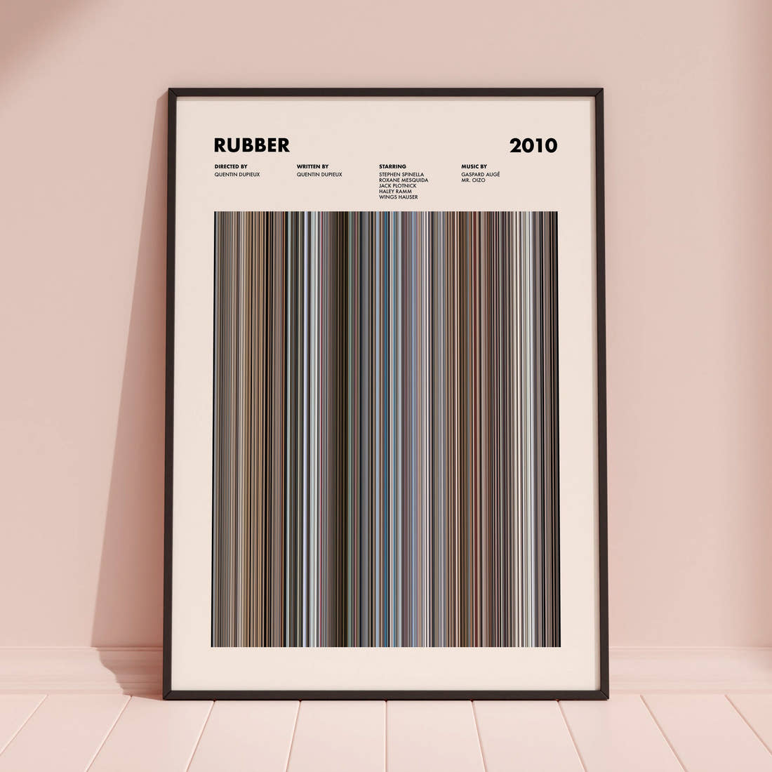 Rubber Movie Barcode Poster framed and leaning against a coloured wall