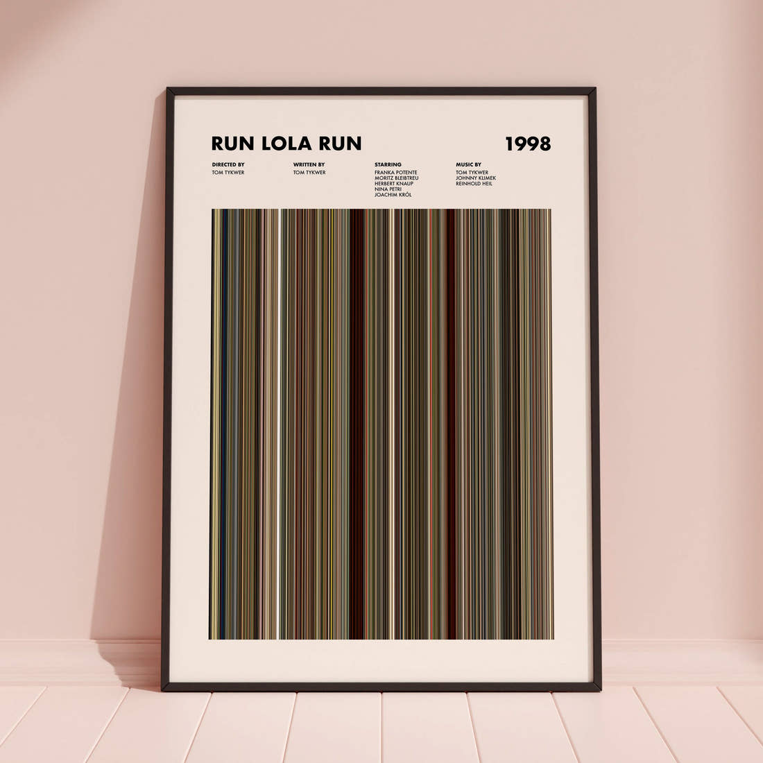 Run Lola Run Movie Barcode Poster framed and leaning against a coloured wall