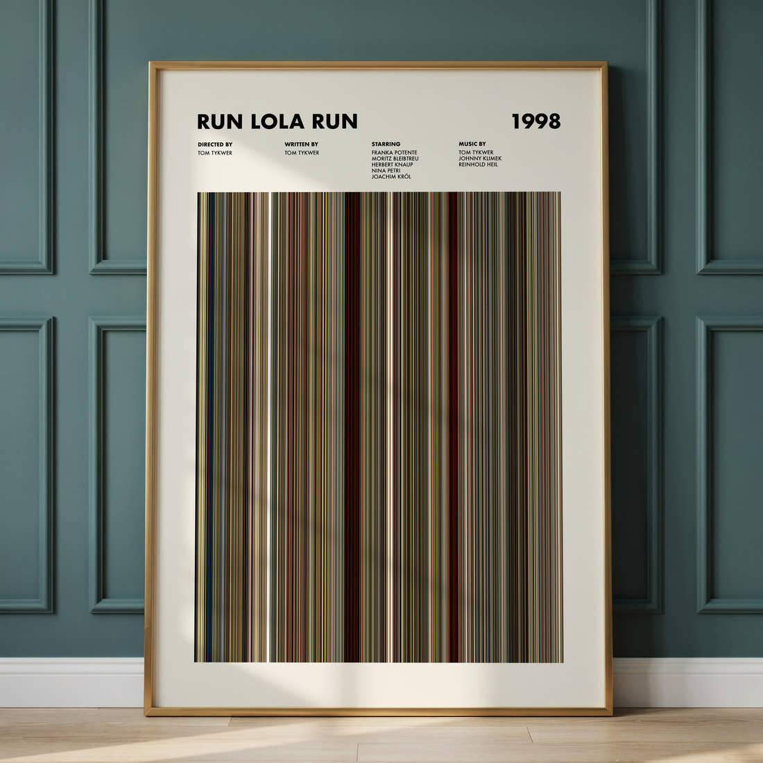 Run Lola Run Movie Barcode Poster framed and leaning against a panelled wall