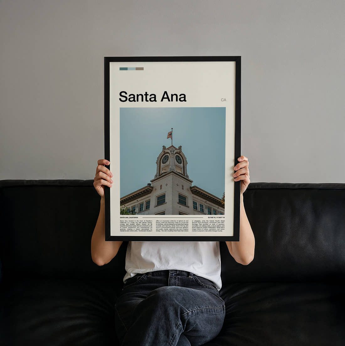 Santa Ana Clock Tower Travel Print held up by hand to show the size of the print