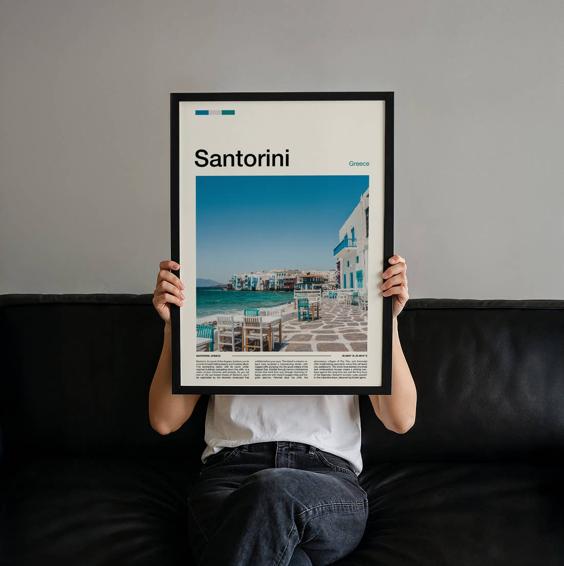 Santorini Waterfront Terrace Travel Print held up by hand to show the size of the print
