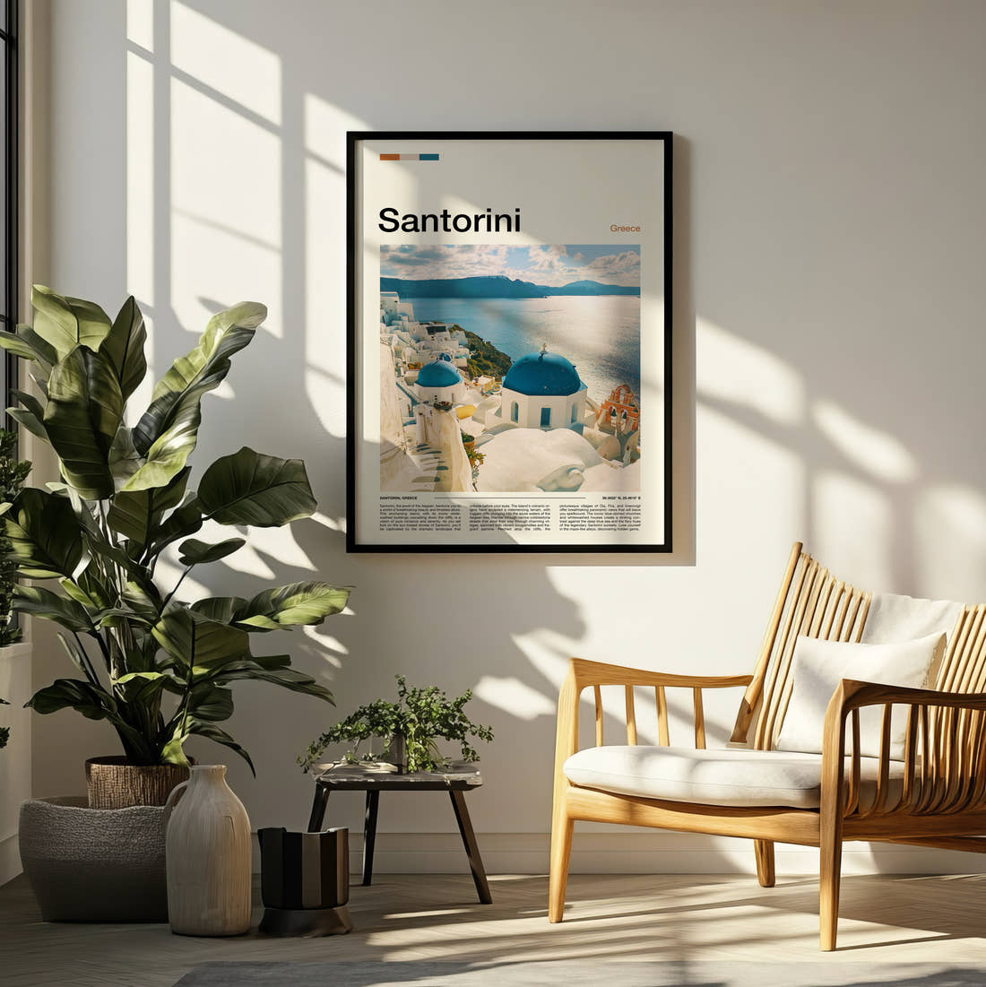 Santorini Blue Domed Churches Travel Print framed on a pale wall beside houseplants