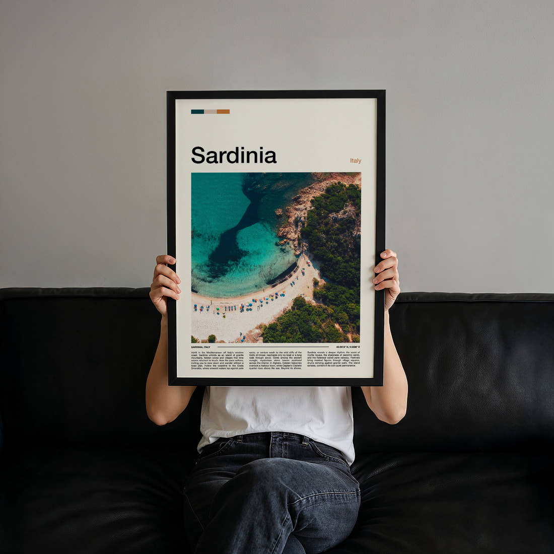 Sardinia Turquoise Cove Aerial Travel Print held up by hand to show the size of the print