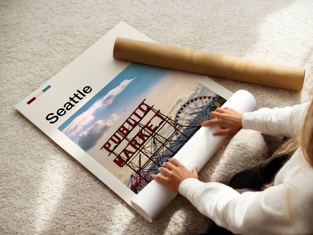 Seattle Public Market Sign And Big Wheel Travel Print being unrolled from its postal tube