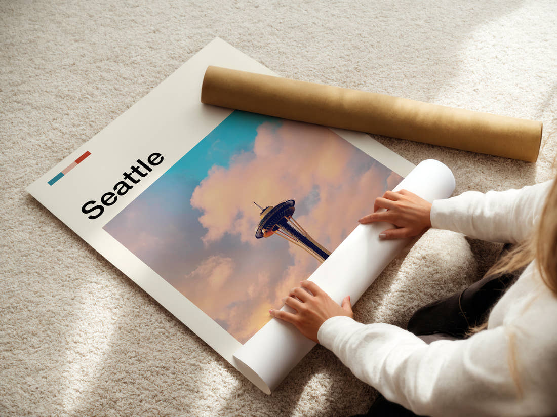 Seattle Space Needle In The Clouds Travel Print being unrolled from its postal tube