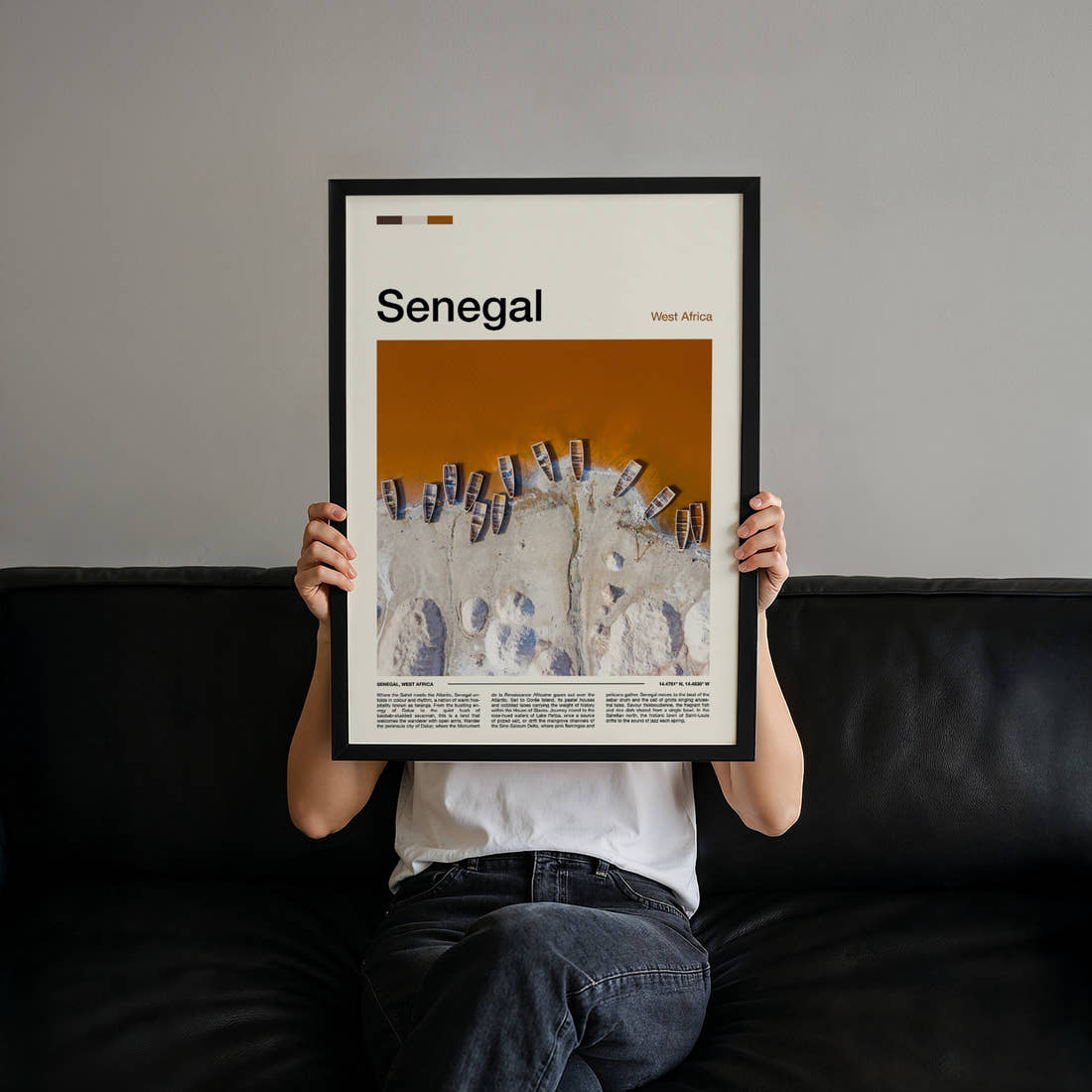 Senegal Aerial Fishing Boats Travel Print held up by hand to show the size of the print