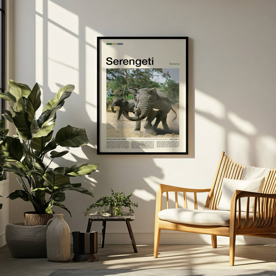 Serengeti Elephants Sparring Travel Print framed on a pale wall beside houseplants