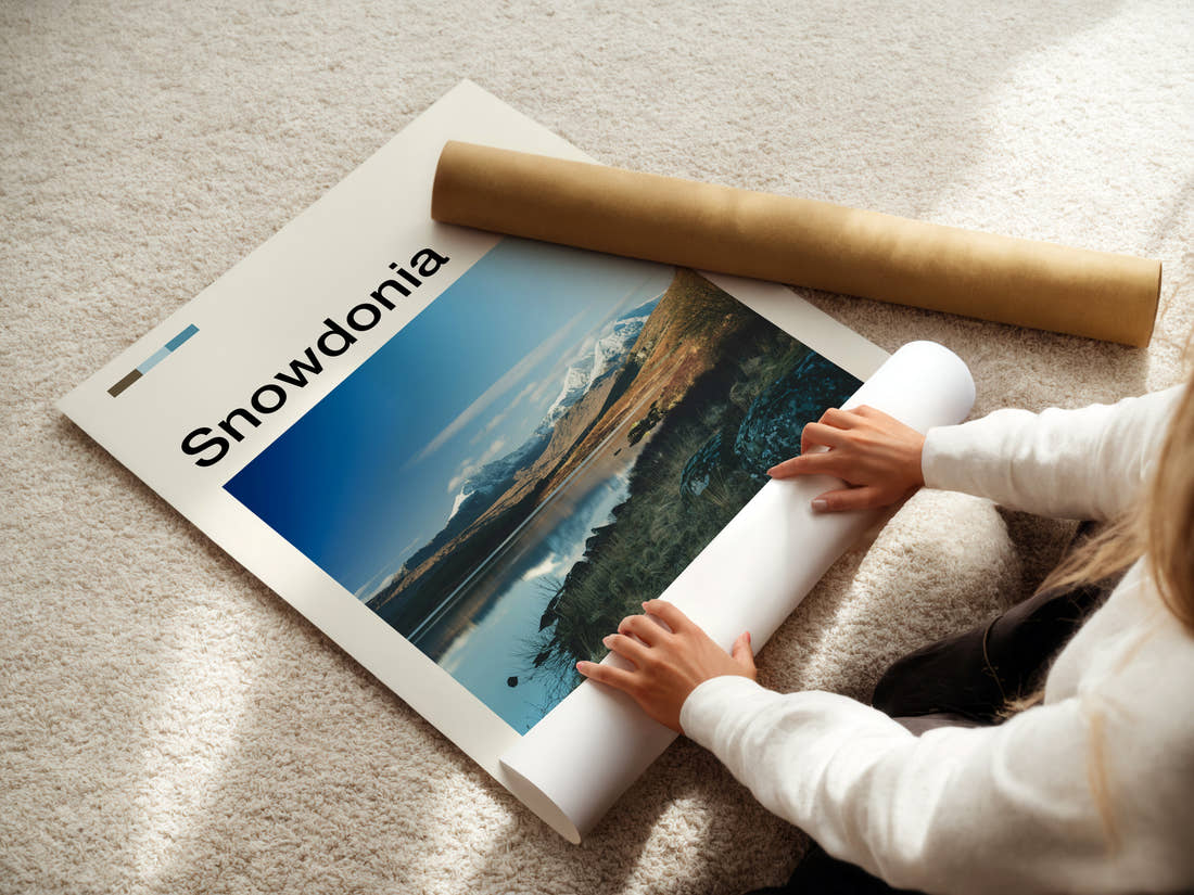 Snowdonia Snow-Capped Mountain Reflection Travel Print being unrolled from its postal tube
