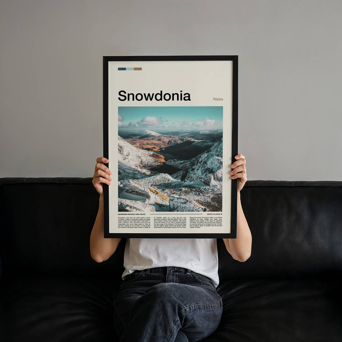 Snowdonia Snow-Capped Ridge Valley Travel Print held up by hand to show the size of the print
