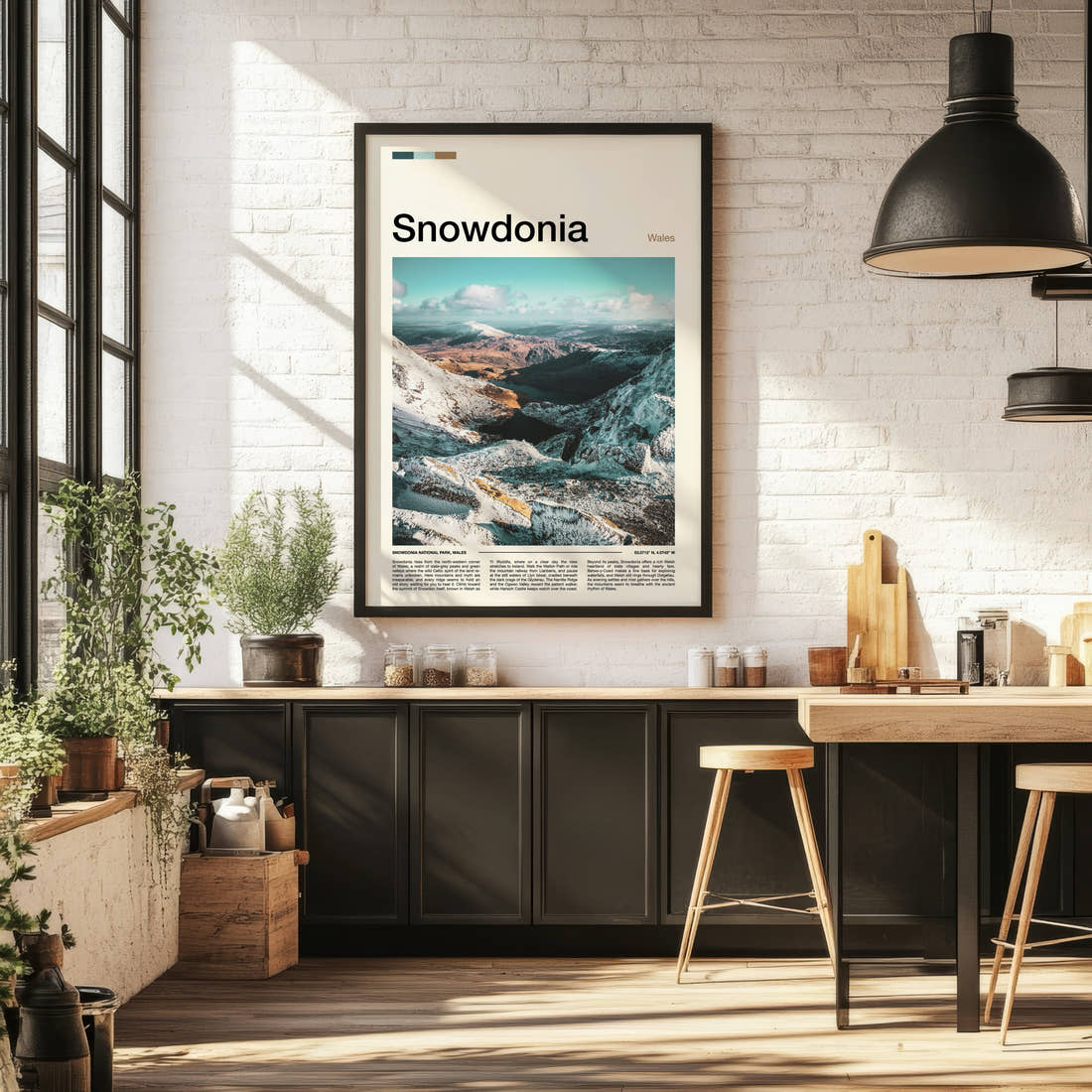Snowdonia Snow-Capped Ridge Valley Travel Print framed on the wall of a bright kitchen and dining space
