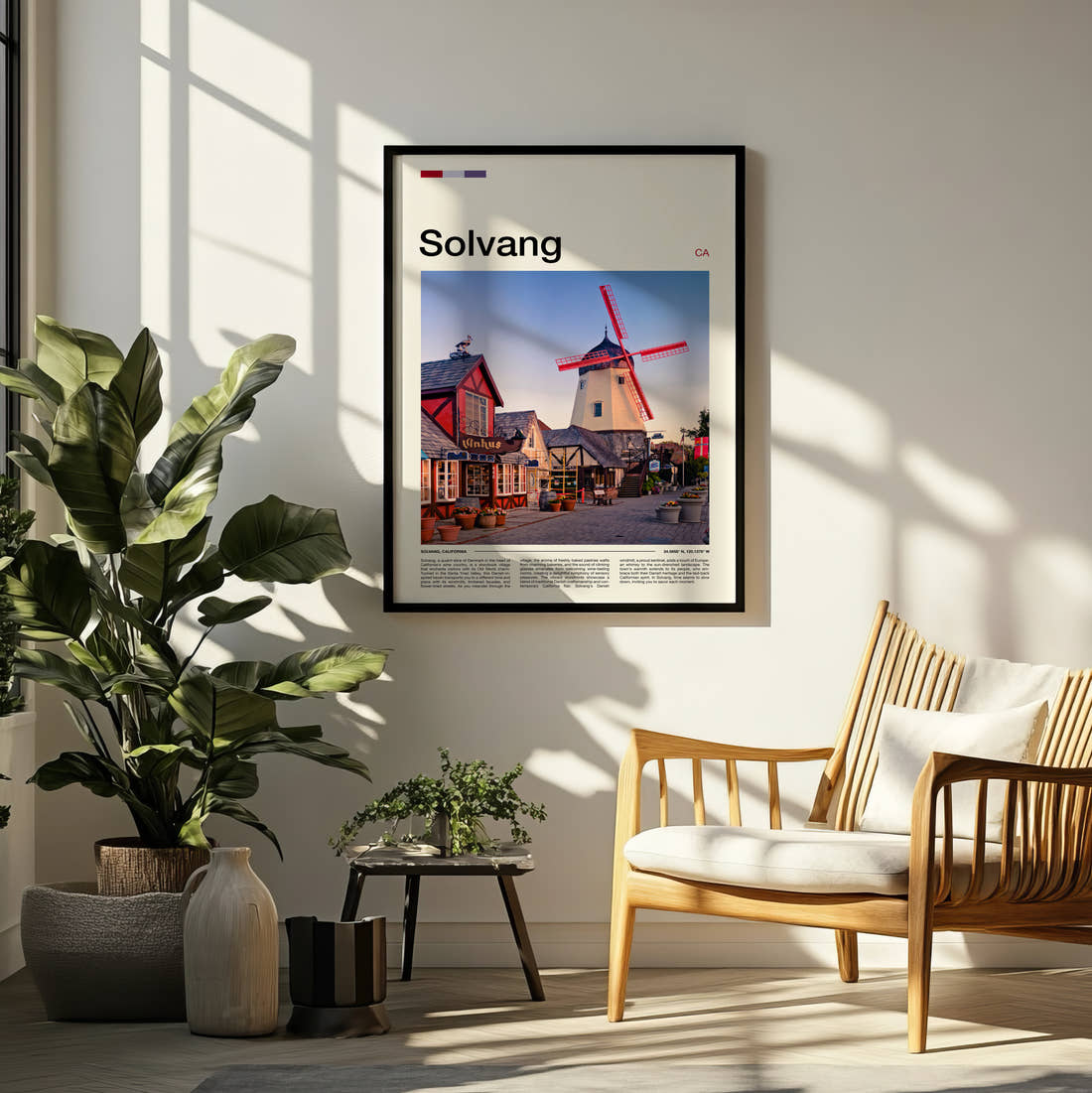 Solvang Danish Windmill Travel Print framed on a pale wall beside houseplants