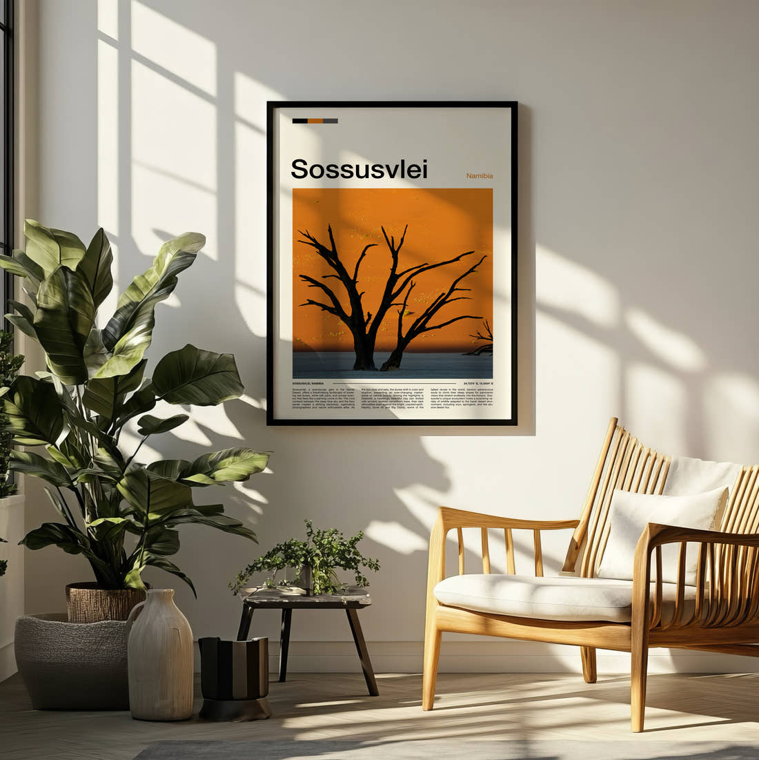 Sossusvlei Dead Tree Silhouette Travel Print framed on a pale wall beside houseplants