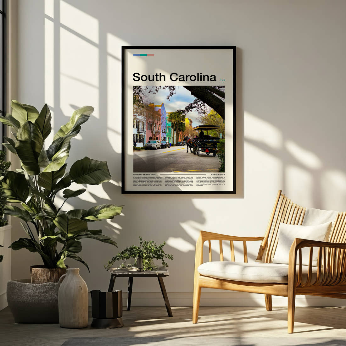 South Carolina Rainbow Row Travel Print framed on a pale wall beside houseplants