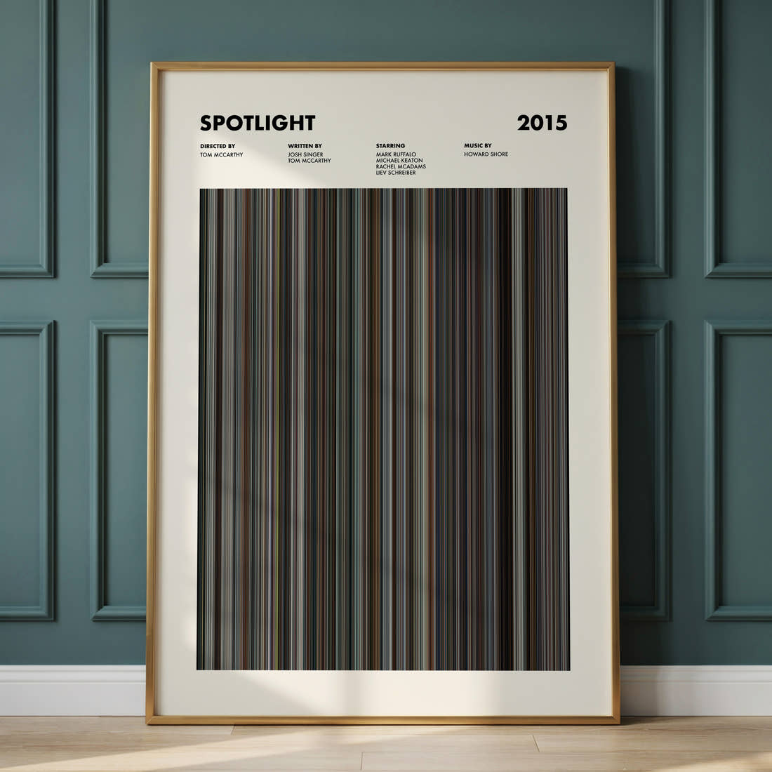 Spotlight Movie Barcode Poster framed and leaning against a panelled wall