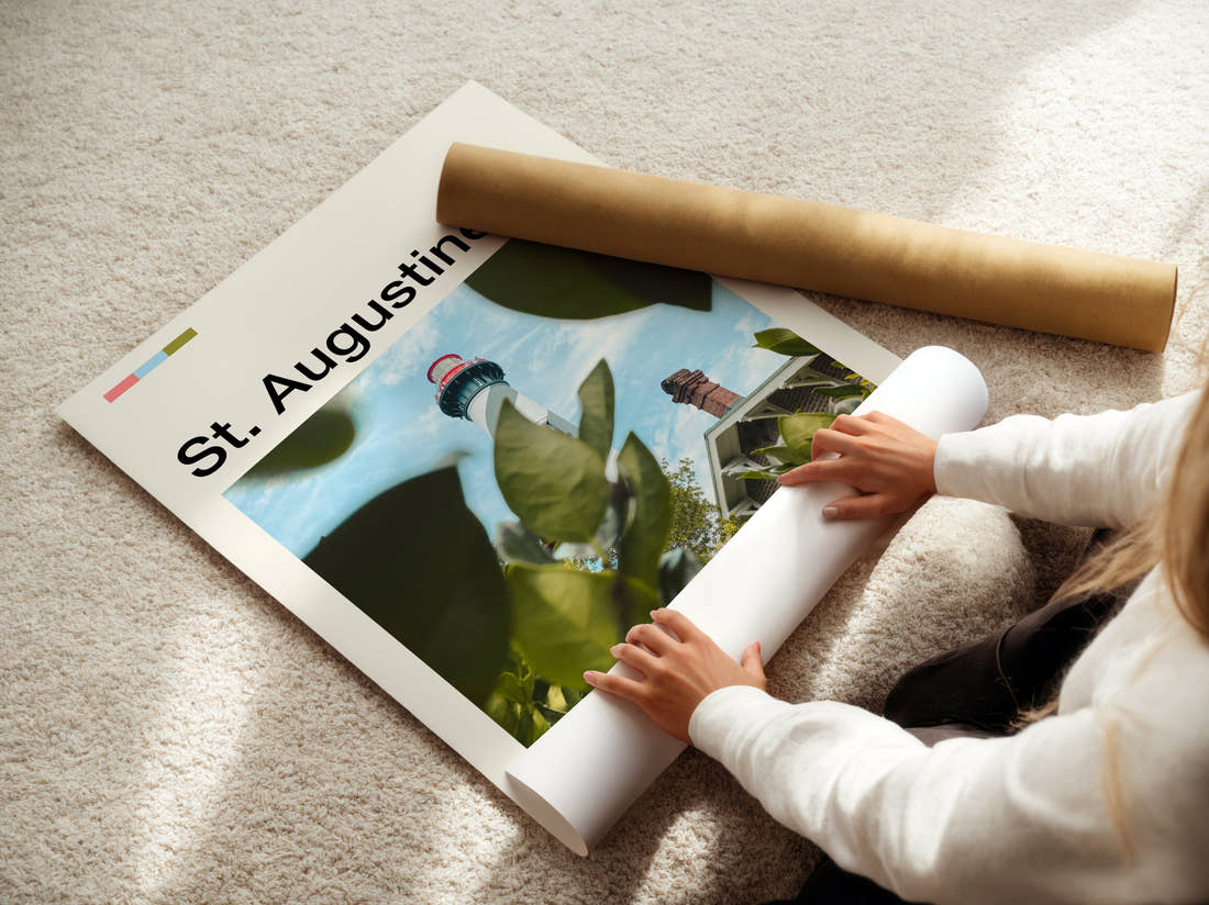 St Augustine Lighthouse Through Foliage Travel Print being unrolled from its postal tube