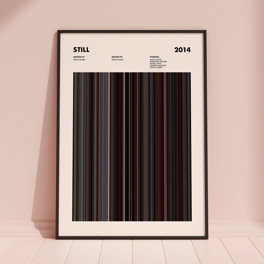 Still Movie Barcode Poster framed and leaning against a coloured wall