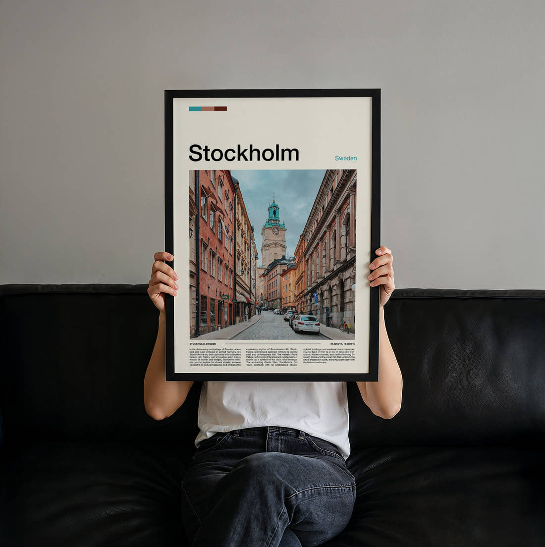 Stockholm Street And Clock Tower Travel Print held up by hand to show the size of the print