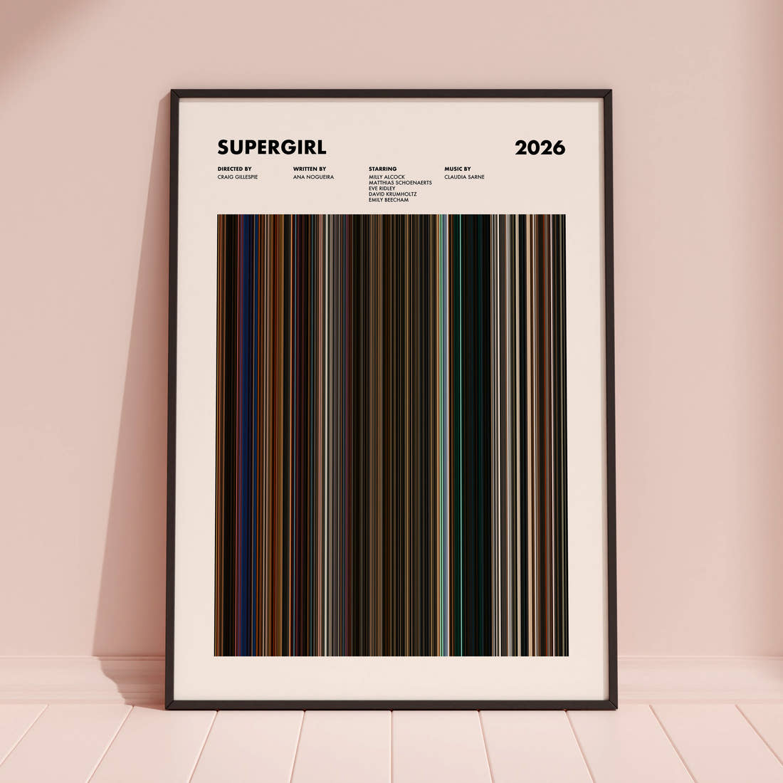 Supergirl Movie Barcode Poster framed and leaning against a coloured wall