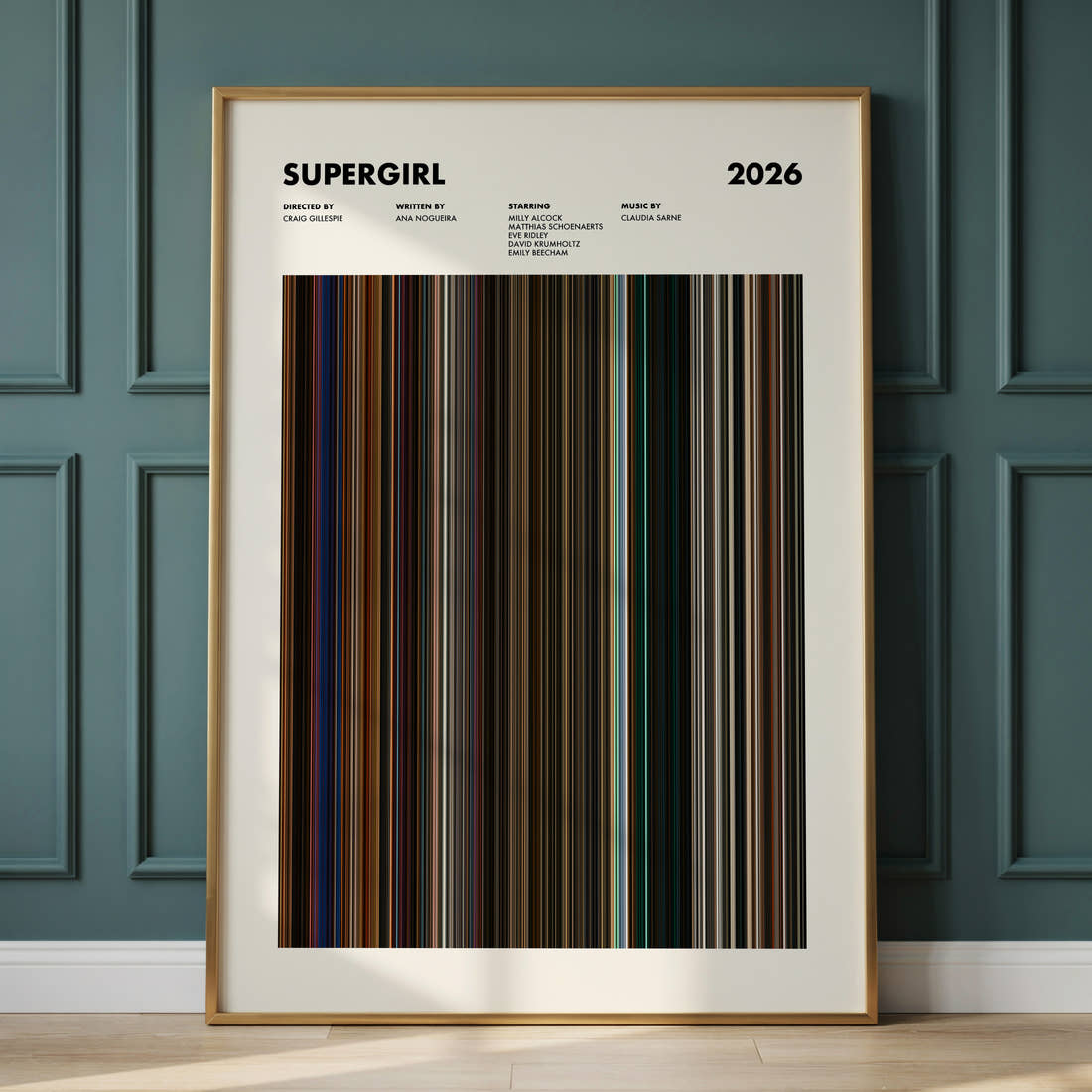Supergirl Movie Barcode Poster framed and leaning against a panelled wall