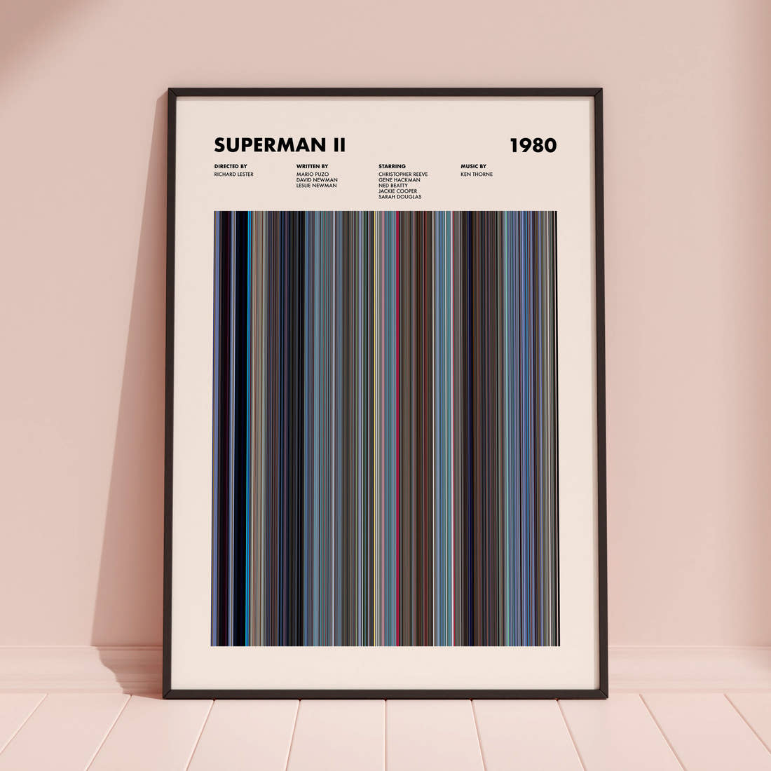 Superman 2 Movie Barcode Poster framed and leaning against a coloured wall