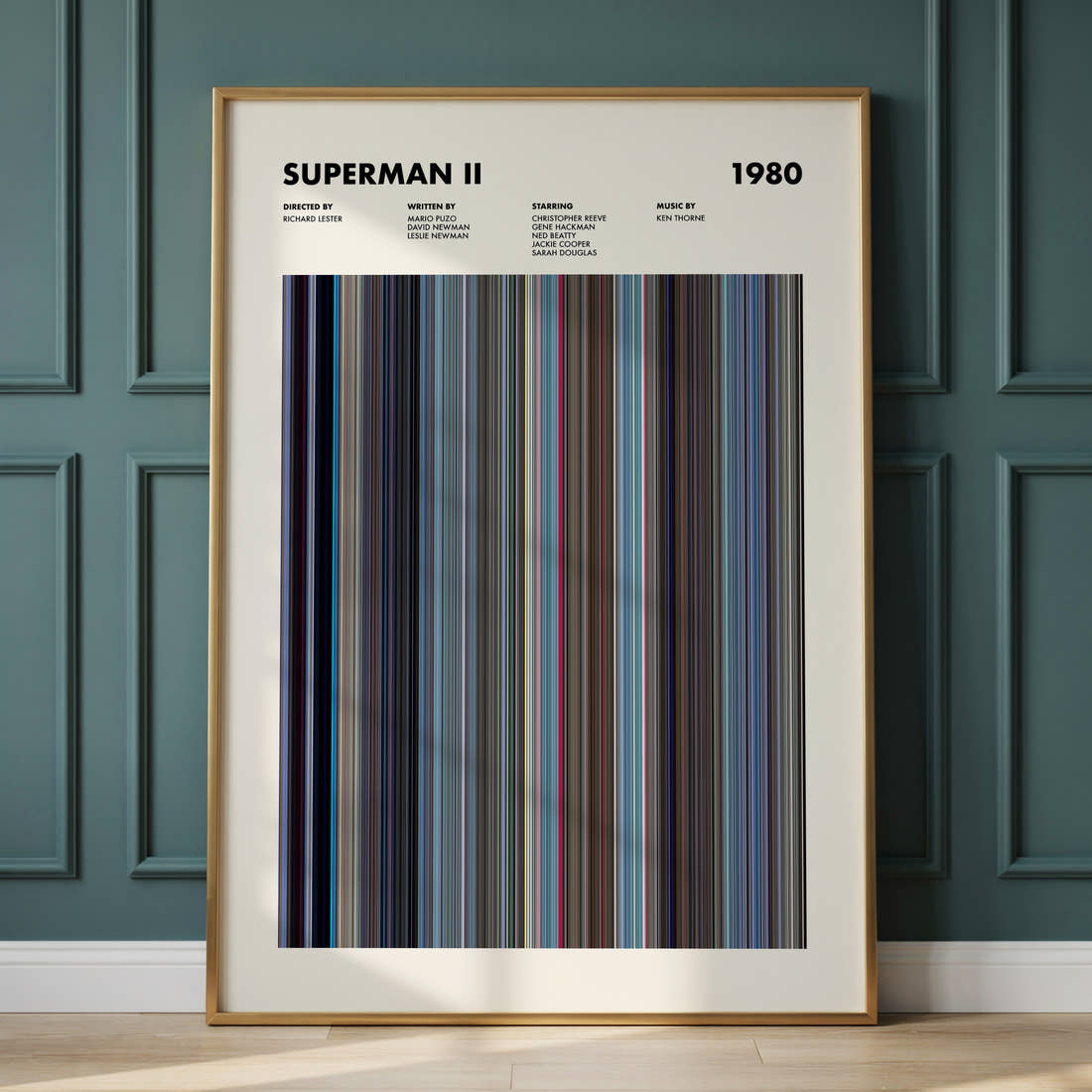 Superman 2 Movie Barcode Poster framed and leaning against a panelled wall