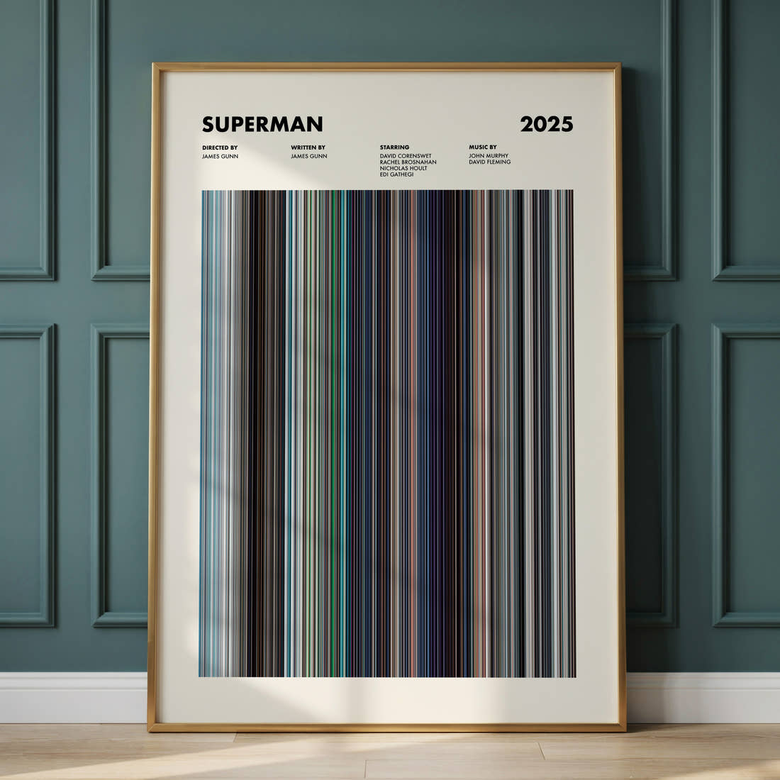 Superman (2025) Movie Barcode Poster framed and leaning against a panelled wall