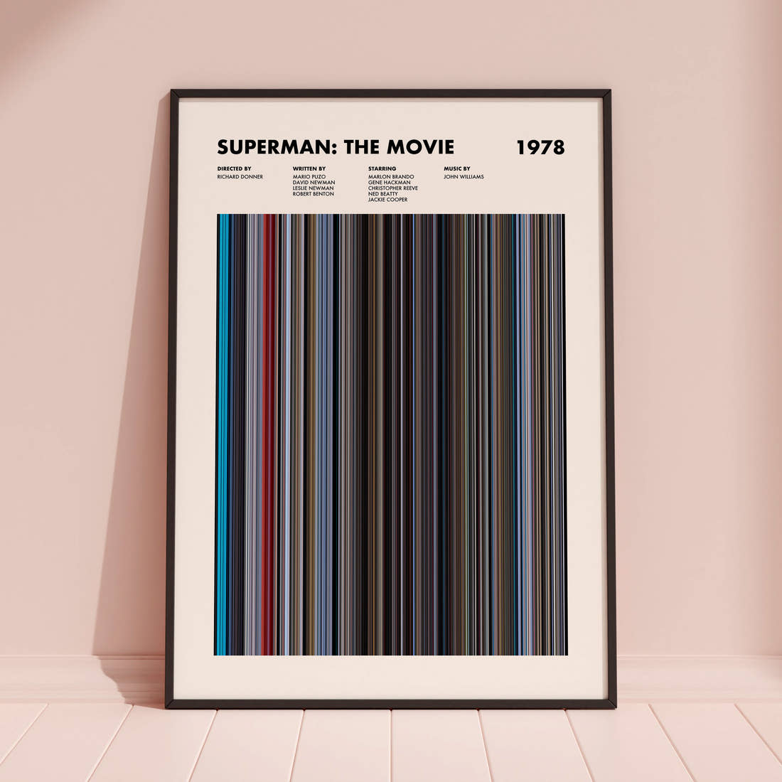Superman Movie Barcode Poster framed and leaning against a coloured wall