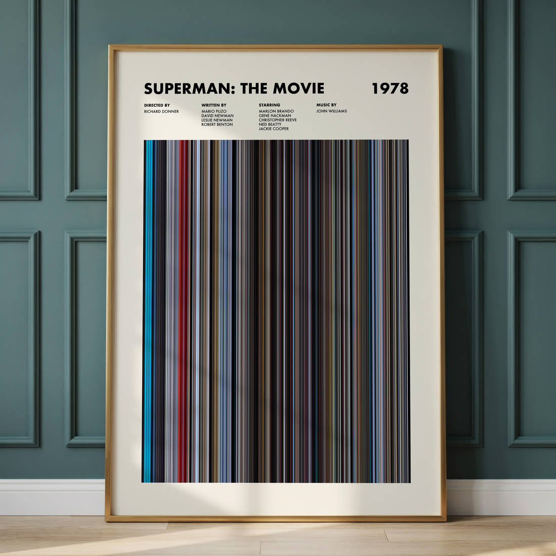 Superman Movie Barcode Poster framed and leaning against a panelled wall