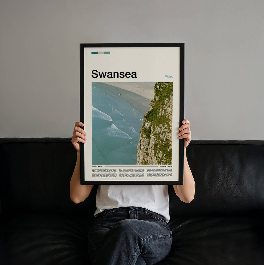 Swansea Cliff Above The Beach Travel Print held up by hand to show the size of the print