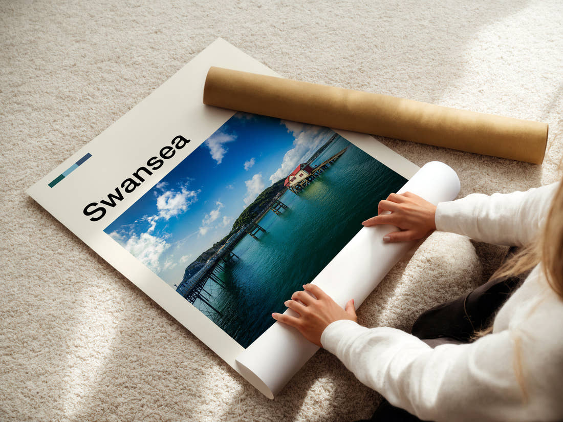 Swansea Mumbles Pier Travel Print being unrolled from its postal tube
