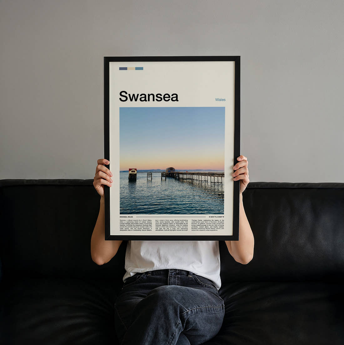 Swansea Pier At Sunset Travel Print held up by hand to show the size of the print