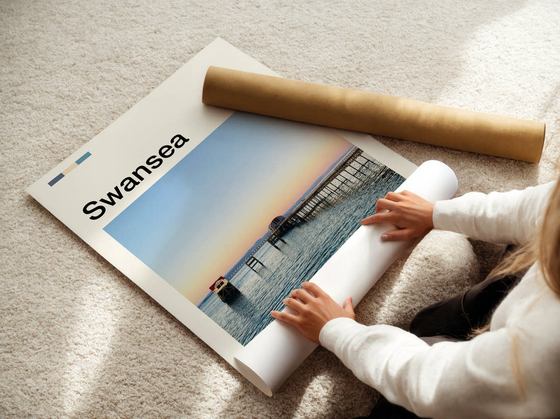 Swansea Pier At Sunset Travel Print being unrolled from its postal tube
