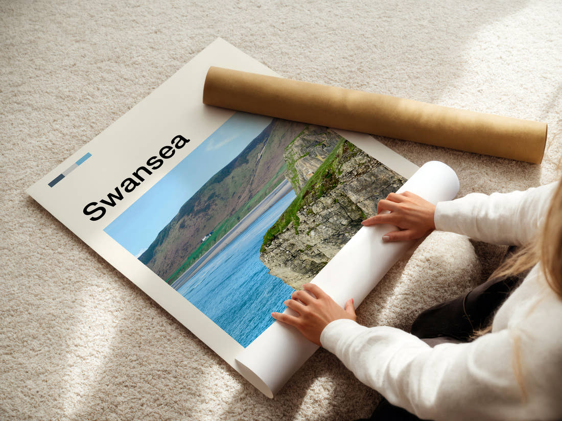 Swansea Worms Head Travel Print being unrolled from its postal tube