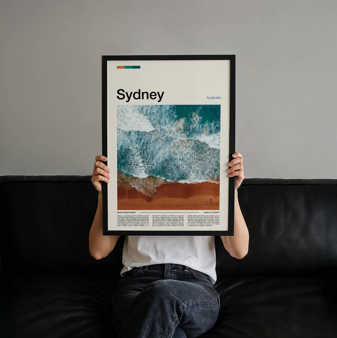 Sydney Aerial Waves On Sand Travel Print held up by hand to show the size of the print