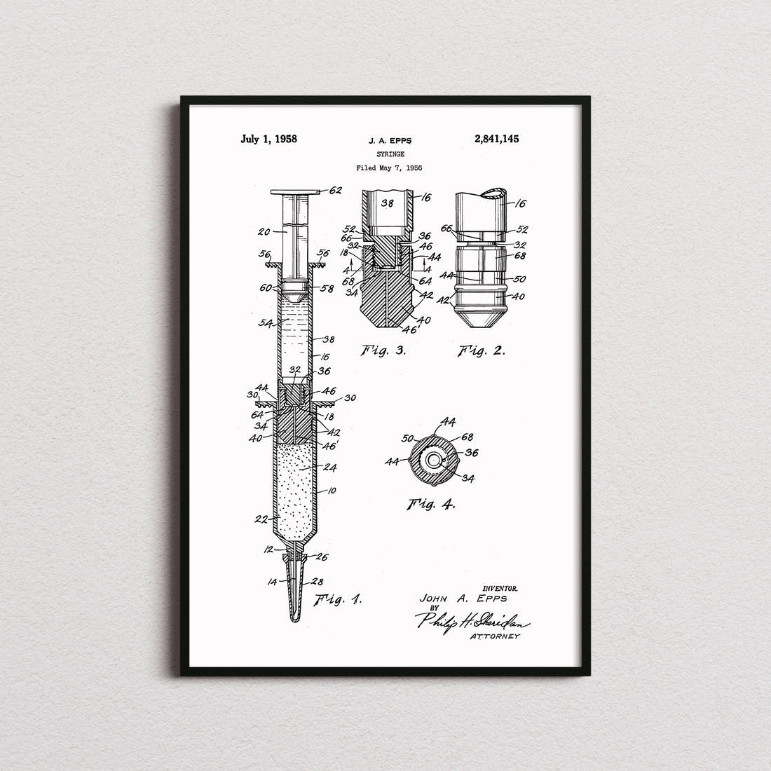 Syringe Patent Print in the white colourway, framed