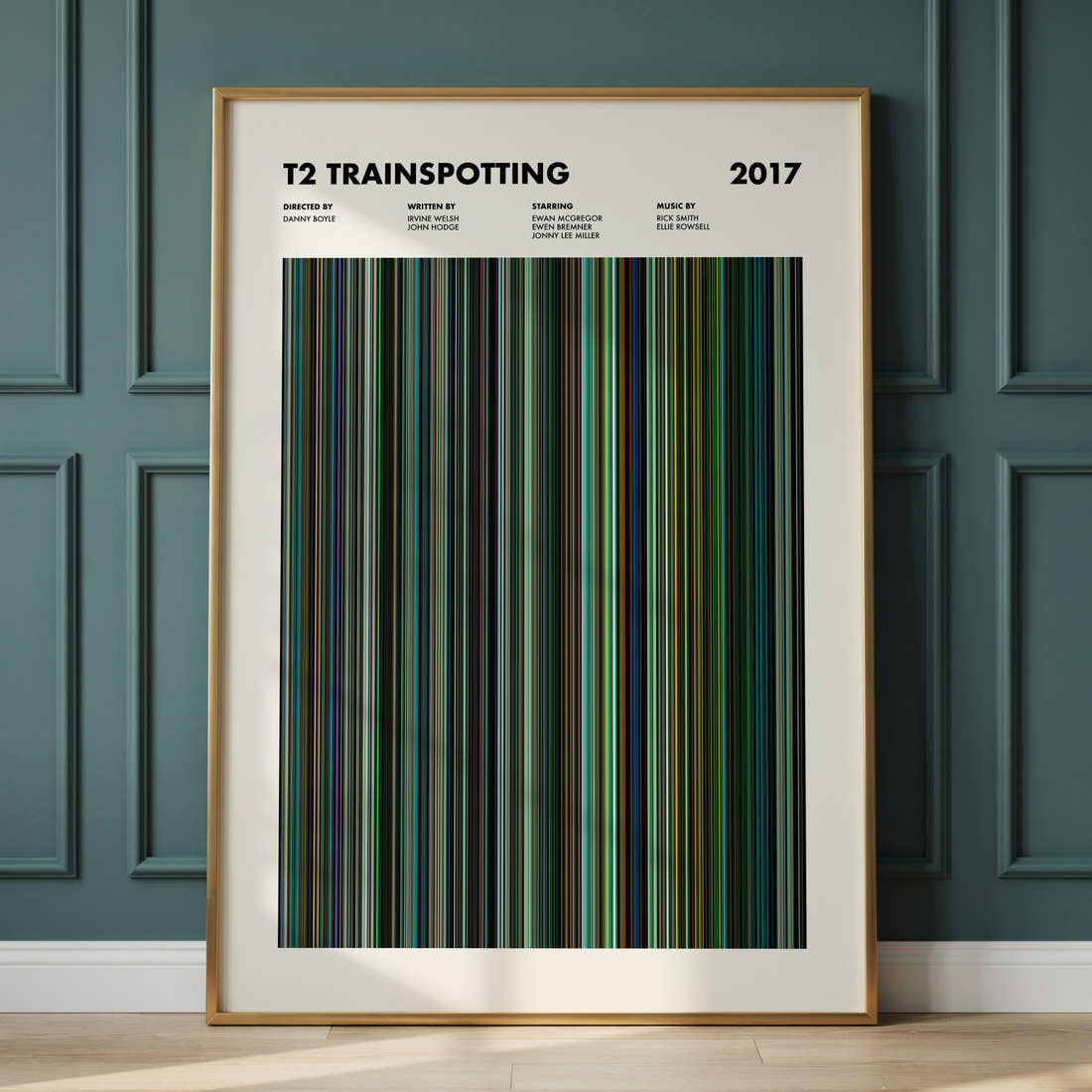 T2 Trainspotting Movie Barcode Poster framed and leaning against a panelled wall