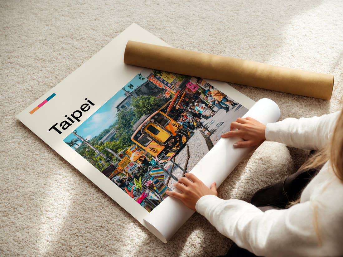 Taipei Train On Street Travel Print being unrolled from its postal tube