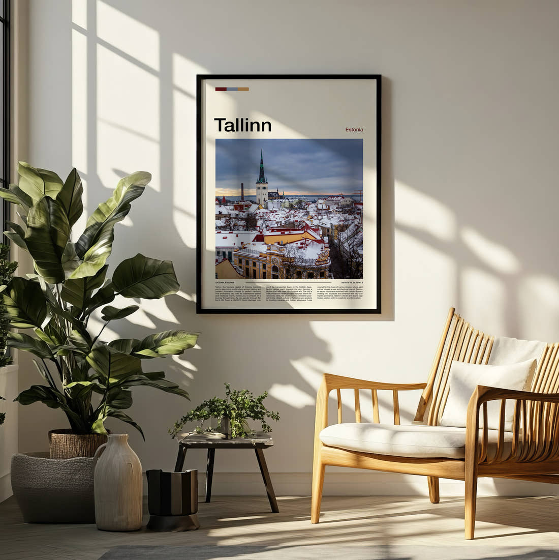 Tallinn Snowy Old Town Travel Print framed on a pale wall beside houseplants