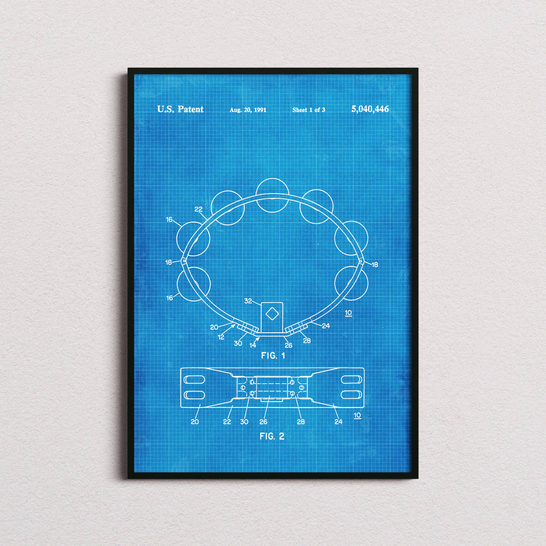 Tambourine Patent Print in the blueprint colourway, framed